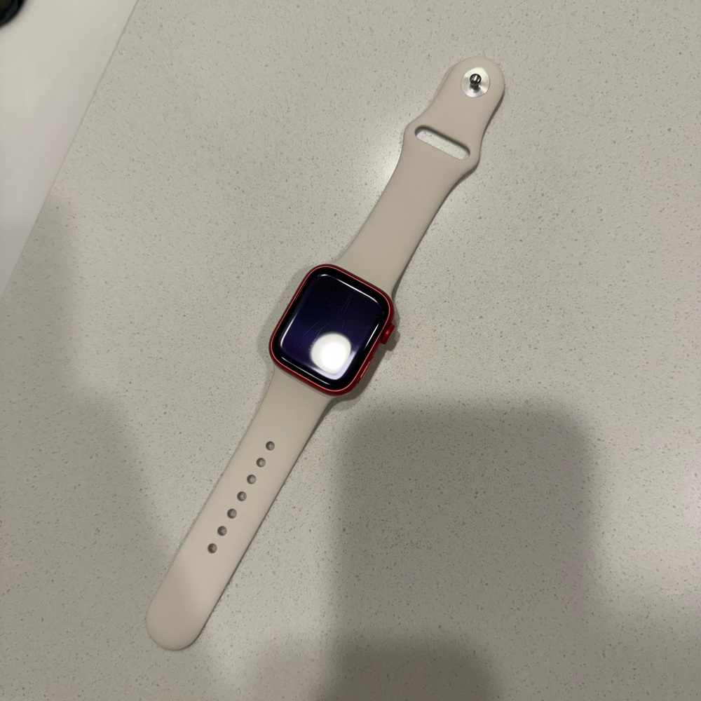 Apple Smartwatch with Red Frame and Cream Strap